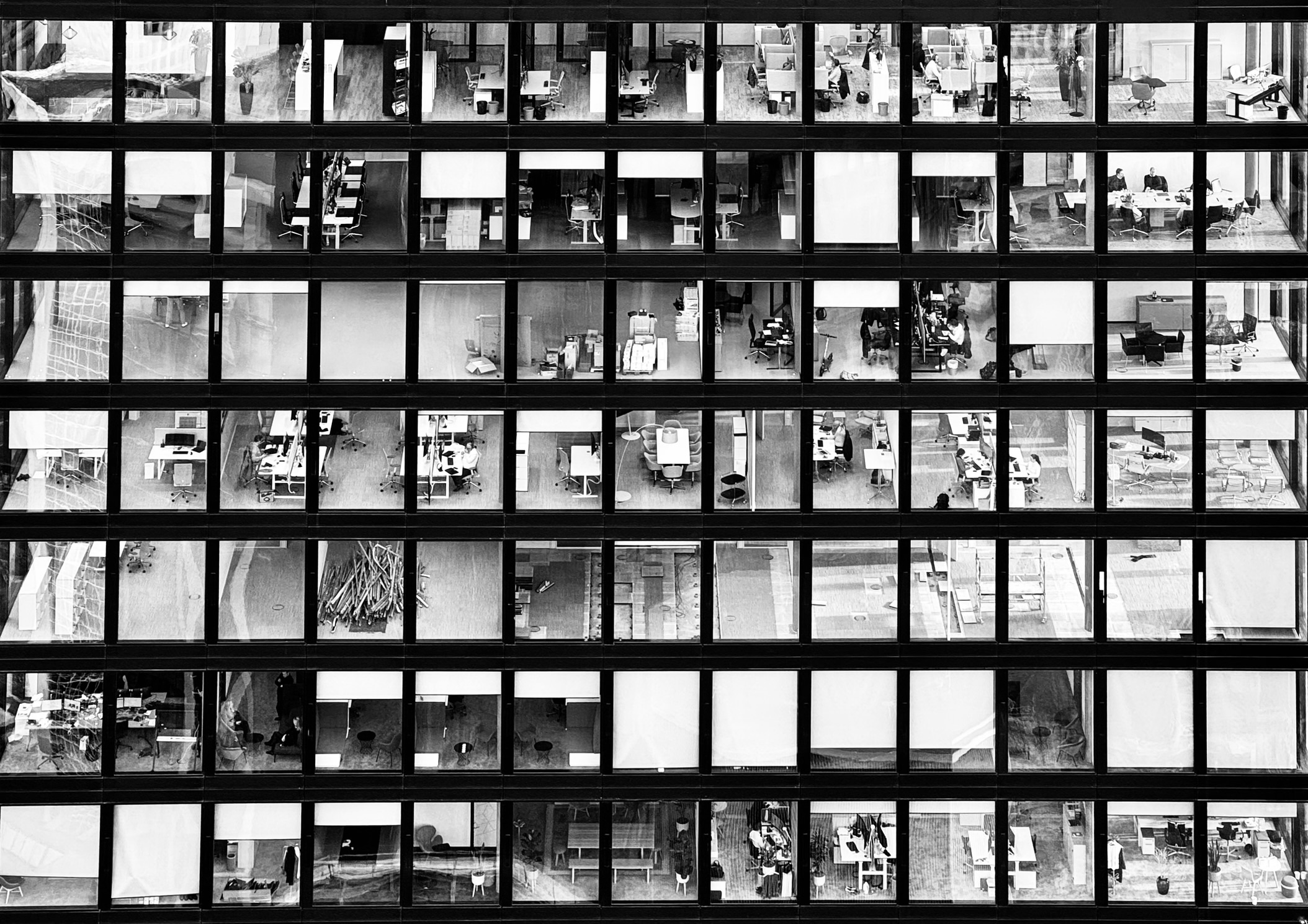 Monochrome view of a glass office building facade